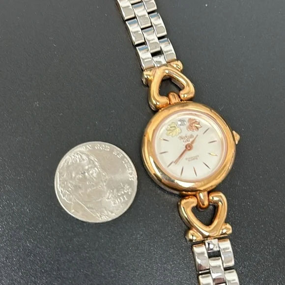EUC Black Hills Gold women’s Watch with genuine diamonds d & reversible band